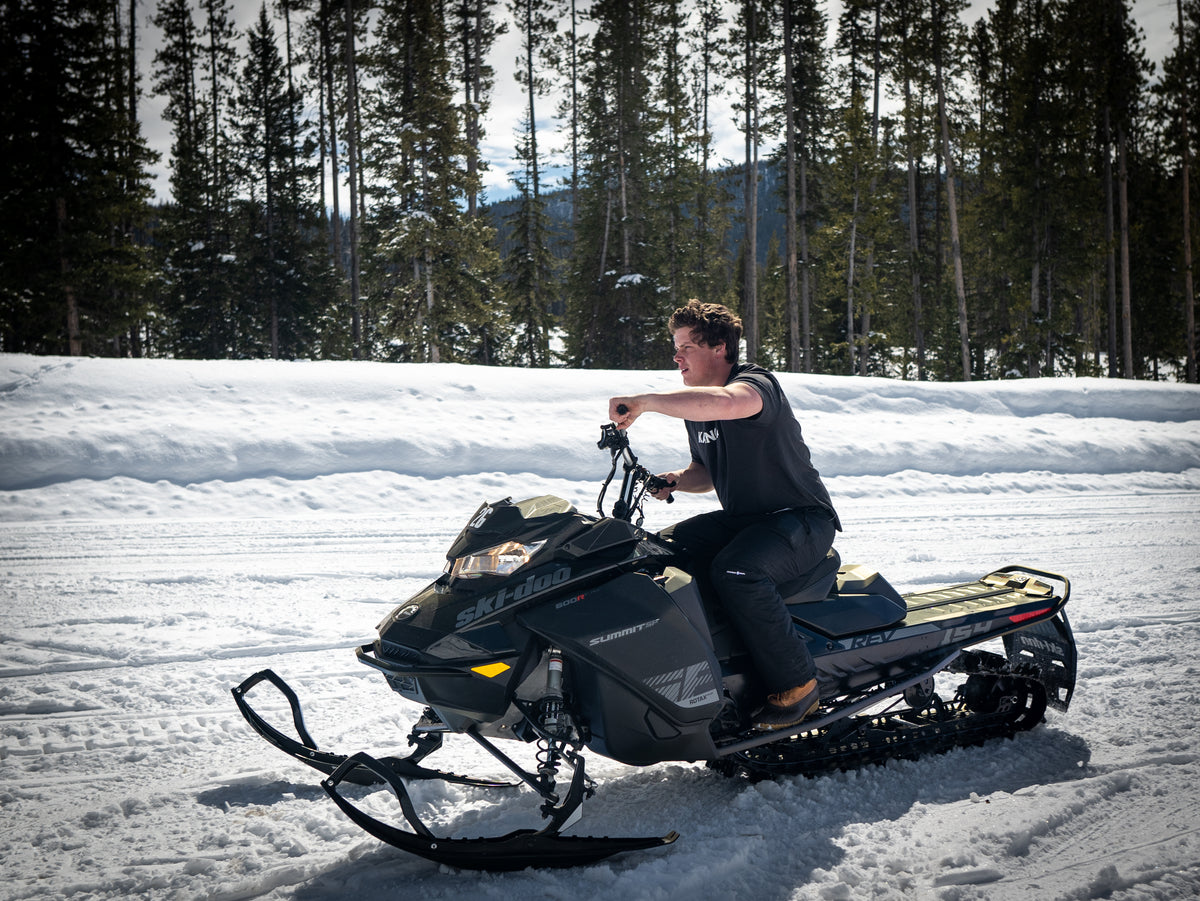 Taking The Edge Off On A Snow Mobile