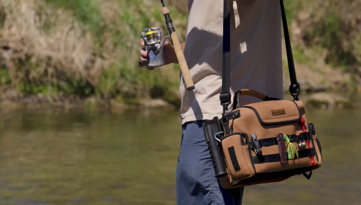 Load video: Man puts rod in rod holder attached to bag